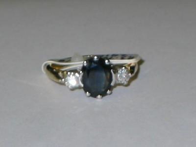 Appraisal: A SAPPHIRE AND DIAMOND THREE STONE RING the oval cut