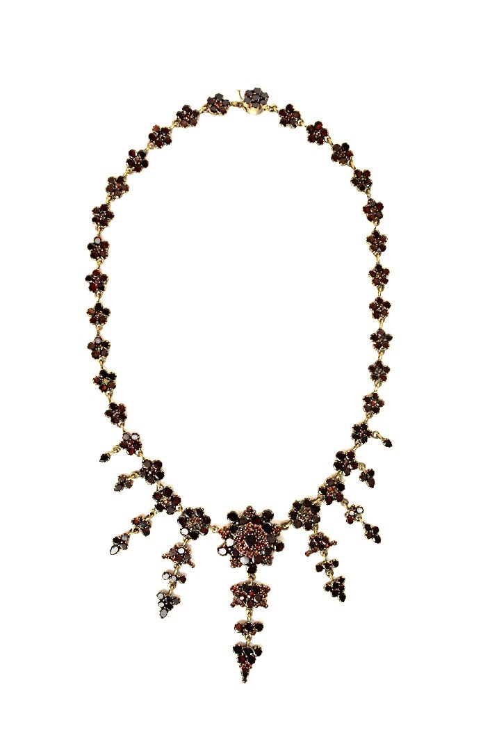 Appraisal: A Bohemian flat cut garnet set collar necklace the links