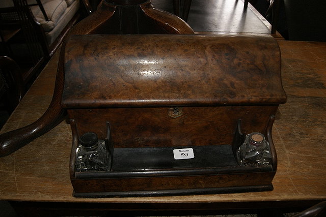 Appraisal: Victorian walnut writing boxwith stylised piano-shaped lid and fitted interior