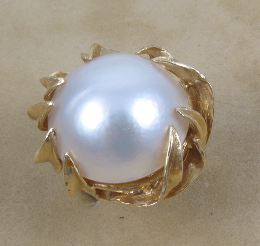 Appraisal: MABE PEARL AND FOURTEEN KARAT GOLD RING The mm diameter