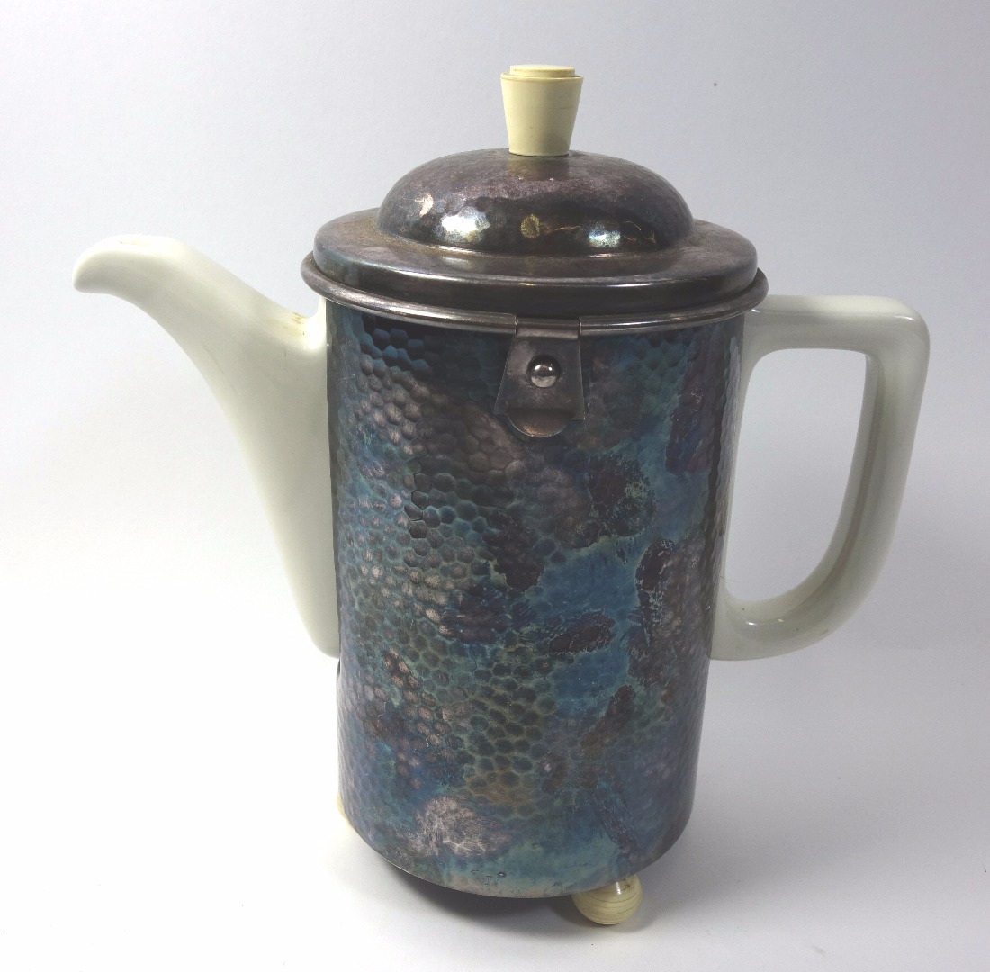 Appraisal: WMF a ceramic and silver plated insulated spot hammered coffee