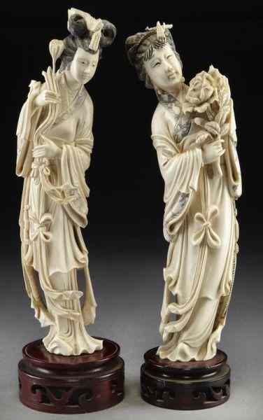 Appraisal: Pr Chinese carved ivory ladies holding flowers International buyers should