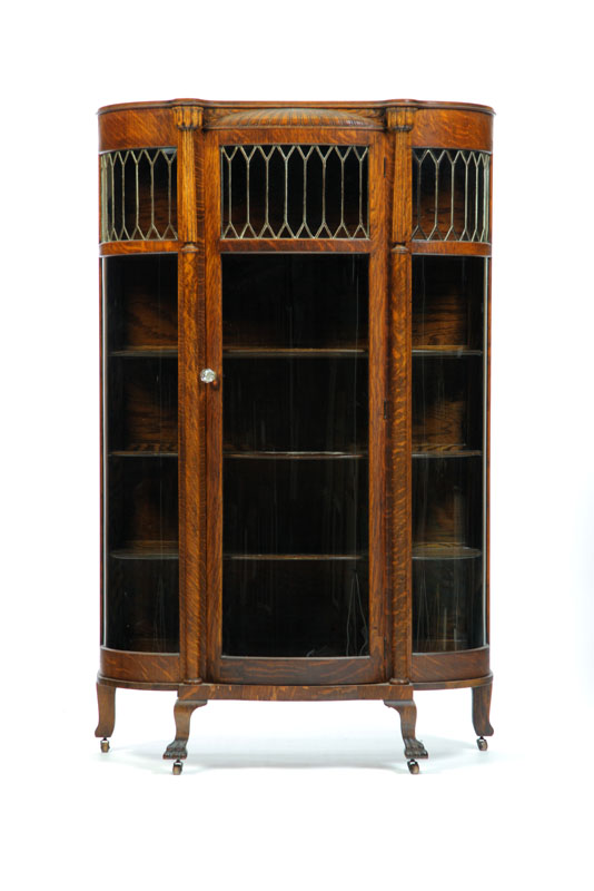 Appraisal: CHINA CABINET Oak with leaded glass curved sides and bowfront