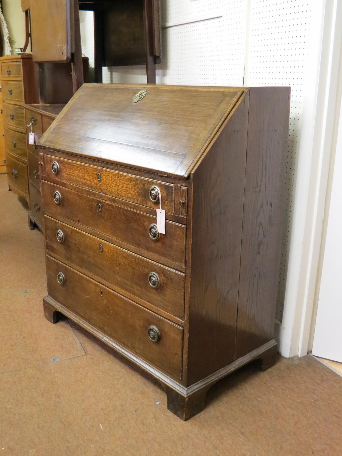 Appraisal: A mid- th century oak bureau stepped interior consisting of