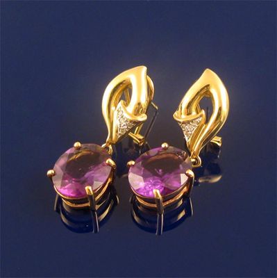 Appraisal: A pair of amethyst and diamond earrings the oval shaped