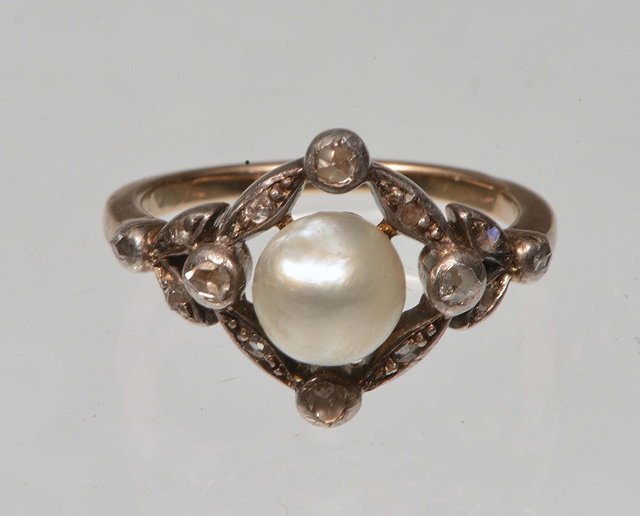 Appraisal: A VICTORIAN PEARL AND DIAMOND SET DRESS RING surrounded by