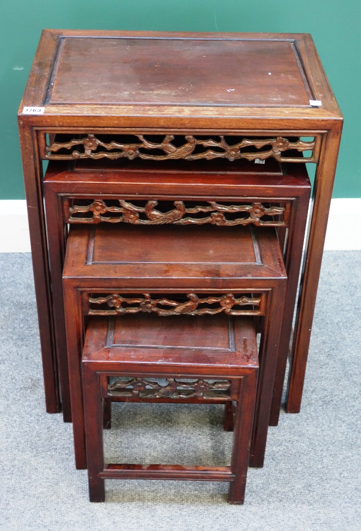 Appraisal: A nest of four Chinese carved hardwood tables on block