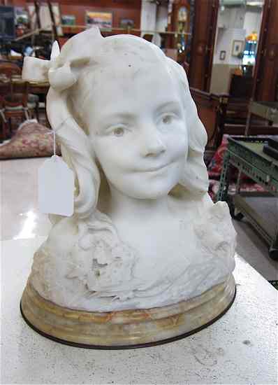 Appraisal: AN ALABASTER SCULPTED BUST of a mischievous young girl with