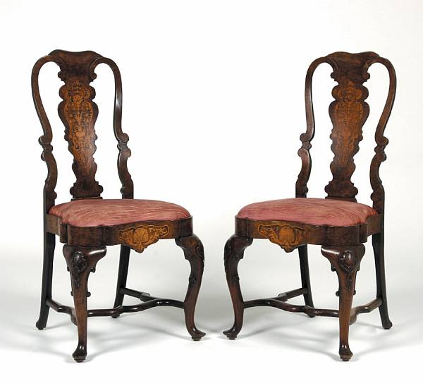 Appraisal: A pair of Dutch Rococo marquetry and walnut side chairs