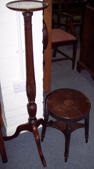 Appraisal: A mahogany torch re the circular top above a reeded