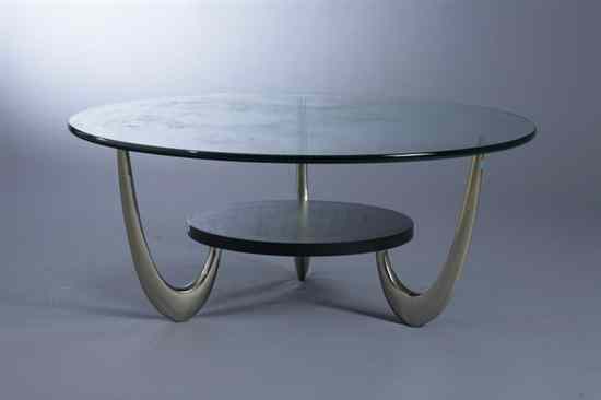 Appraisal: MID-CENTURY-MODERN GLASS TOP SMALL-SIZE COFFEE TABLE Top rests on three