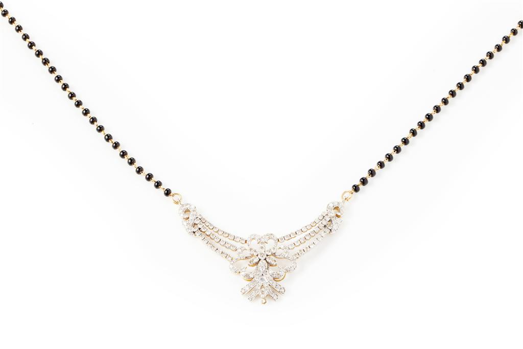 Appraisal: A diamond set necklace the central pierced plaque of tapering