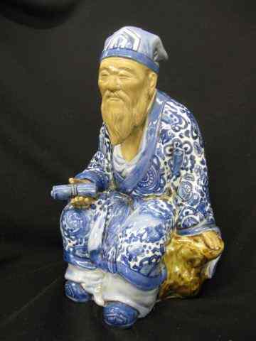 Appraisal: Chinese Mudman Figurine seated scholar blue white decor '' excellent