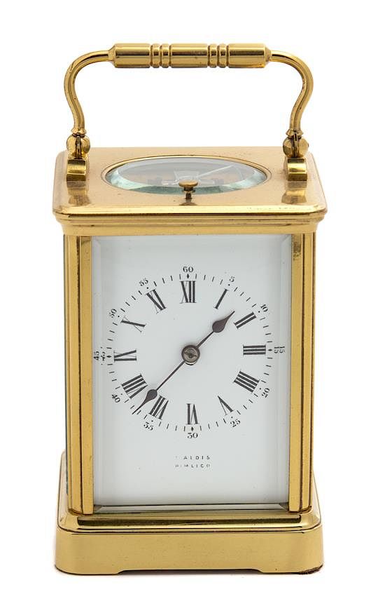 Appraisal: A French Brass Repeater Carriage Clock Height inches A French