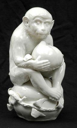 Appraisal: Blanc-de-Chine Porcelain Figure of a Monkey Holding Fruit x in