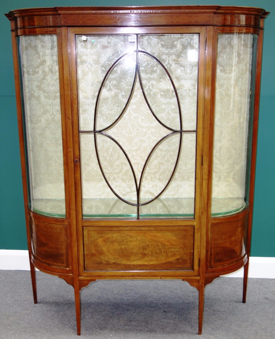 Appraisal: An Edwardian inlaid mahogany display cupboard with central astragal glazed