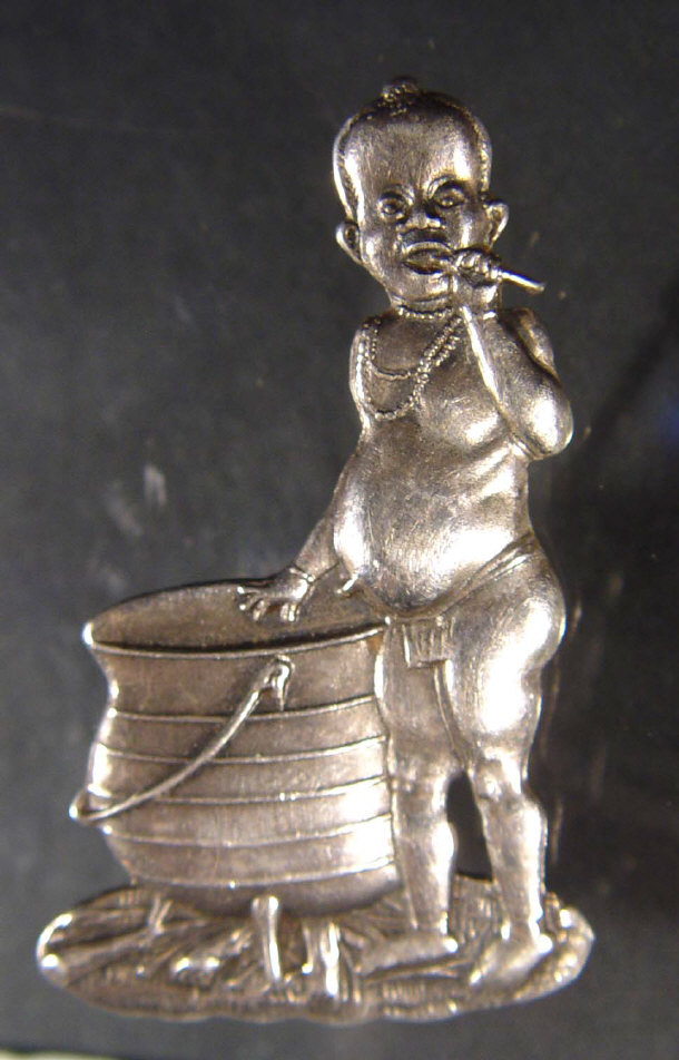 Appraisal: Sterling silver South African child native standing over a cooking