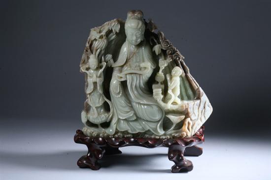 Appraisal: CHINESE CELADON JADE FIGURE OF GUANYIN WITH ATTENDANTS th century