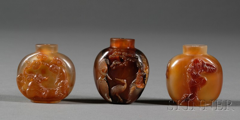 Appraisal: Three Shadow Agate Snuff Bottles carving of a pair of