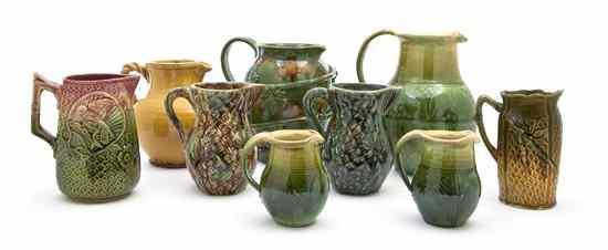 Appraisal: A Collection of Eight Majolica Ewers with various glazes and