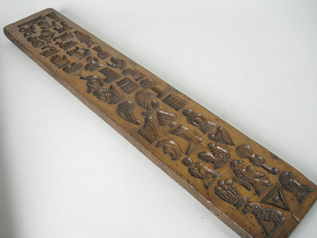 Appraisal: An th th Century carved Biscuit Mould having numerous small