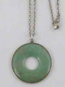 Appraisal: A silver mounted Chinese circular jade pendant approx cm dia