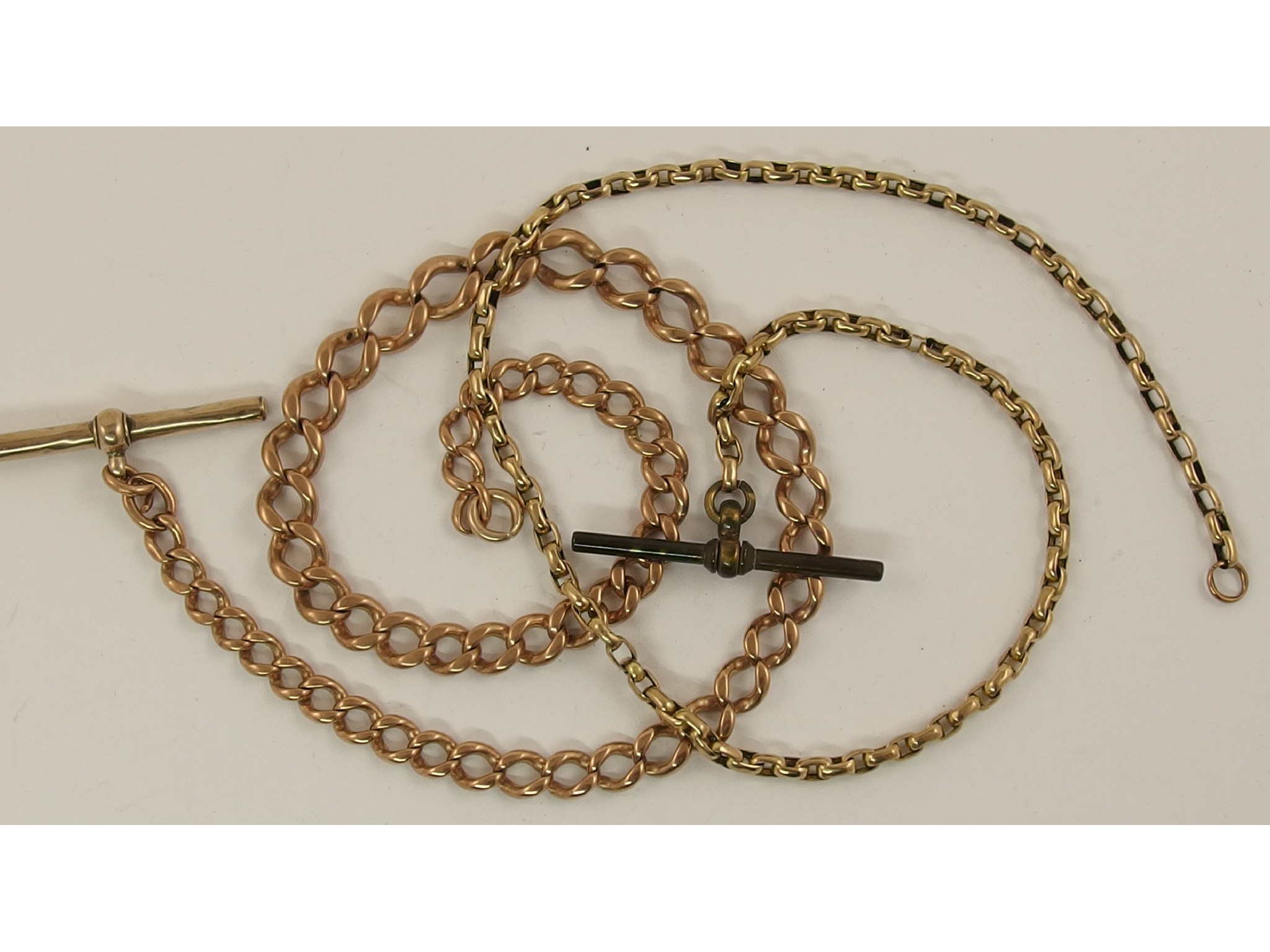 Appraisal: A ct rose gold tapered fob chain and a yellow