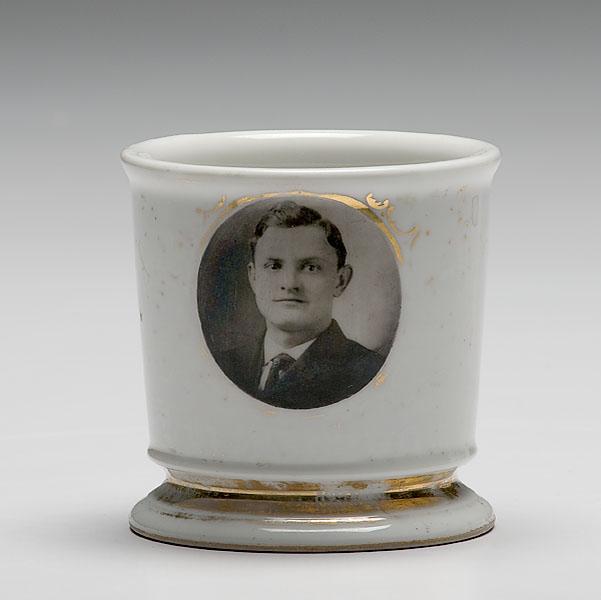 Appraisal: SHAVING MUG WITH PHOTOGRAPHIC TRANSFER PORTRAIT porcelain with monochrome photographic