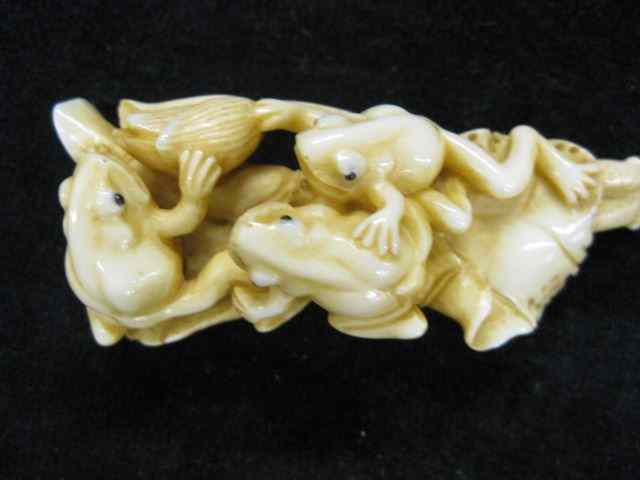 Appraisal: Carved Ivory Netsuke trio of frogs on lotus blossom ''