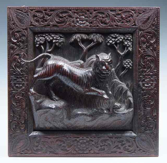 Appraisal: AN INDIAN OR PERSIAN CARVED WOODEN SQUARE PANEL depicting a