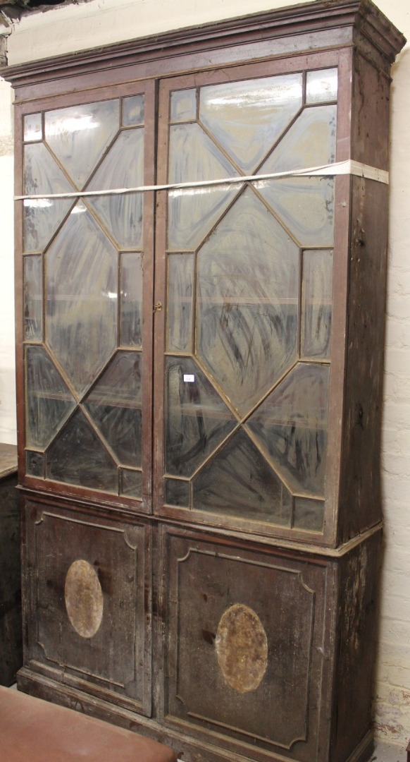 Appraisal: A thC mahogany bookcase with an upper fixed cornice above