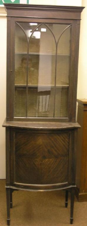 Appraisal: An Edwardian mahogany tall display cabinet cabinet with lined interior