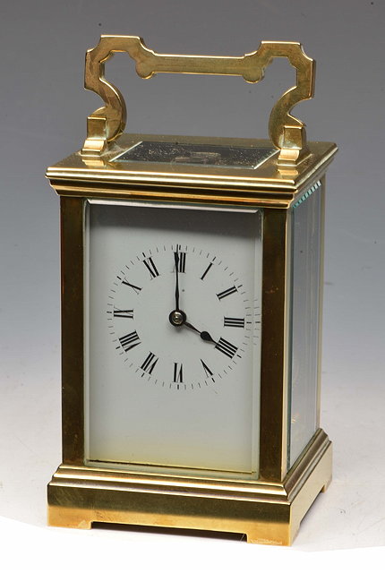 Appraisal: A BRASS CARRIAGE CLOCK with white enamel Roman dial silvered