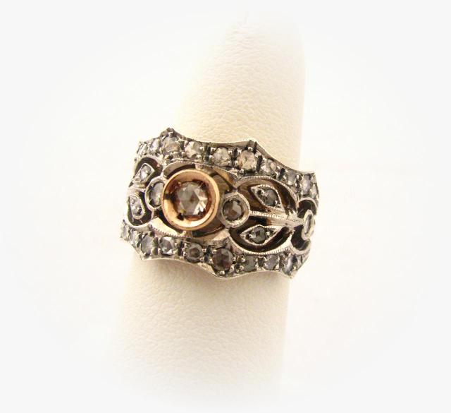 Appraisal: Rose gold and white gold vintage diamond ring with argyle-cut