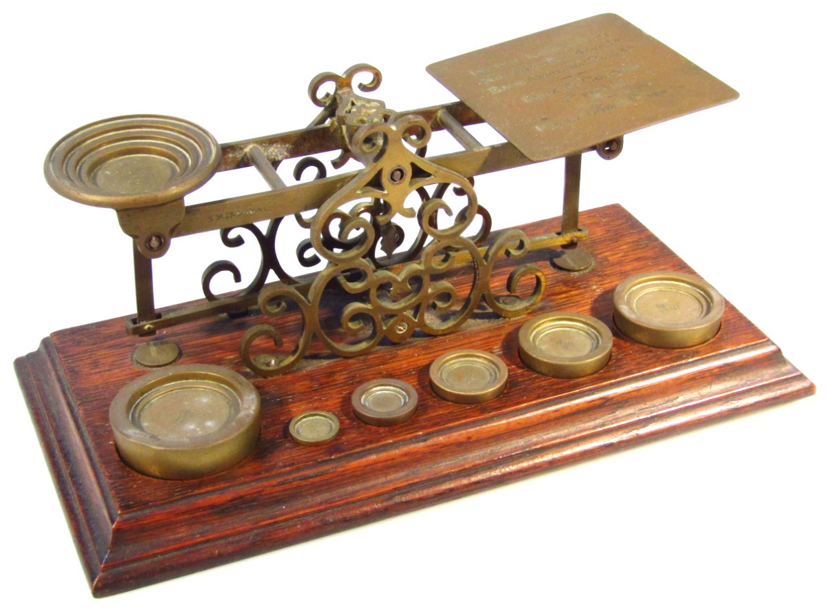 Appraisal: An early thC oak and brass table scale with articulated