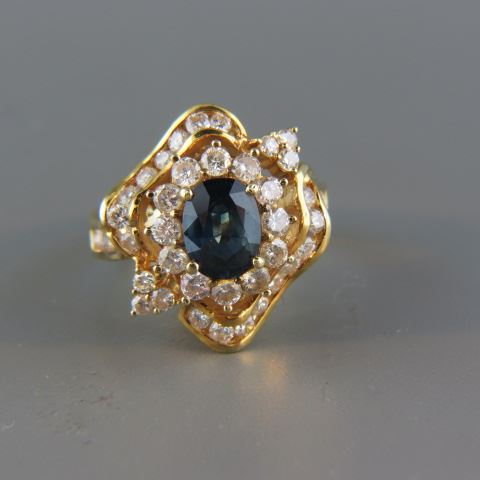 Appraisal: Sapphire and Diamond Ring rich blue oval gem weighing carat