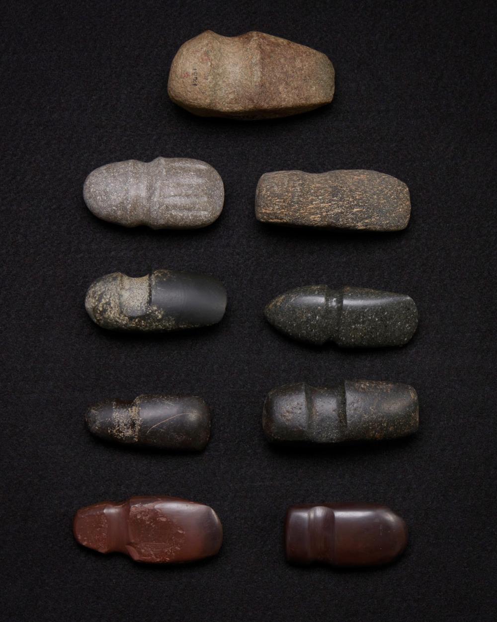 Appraisal: A group of carved stone grooved axes Pre-historic or later