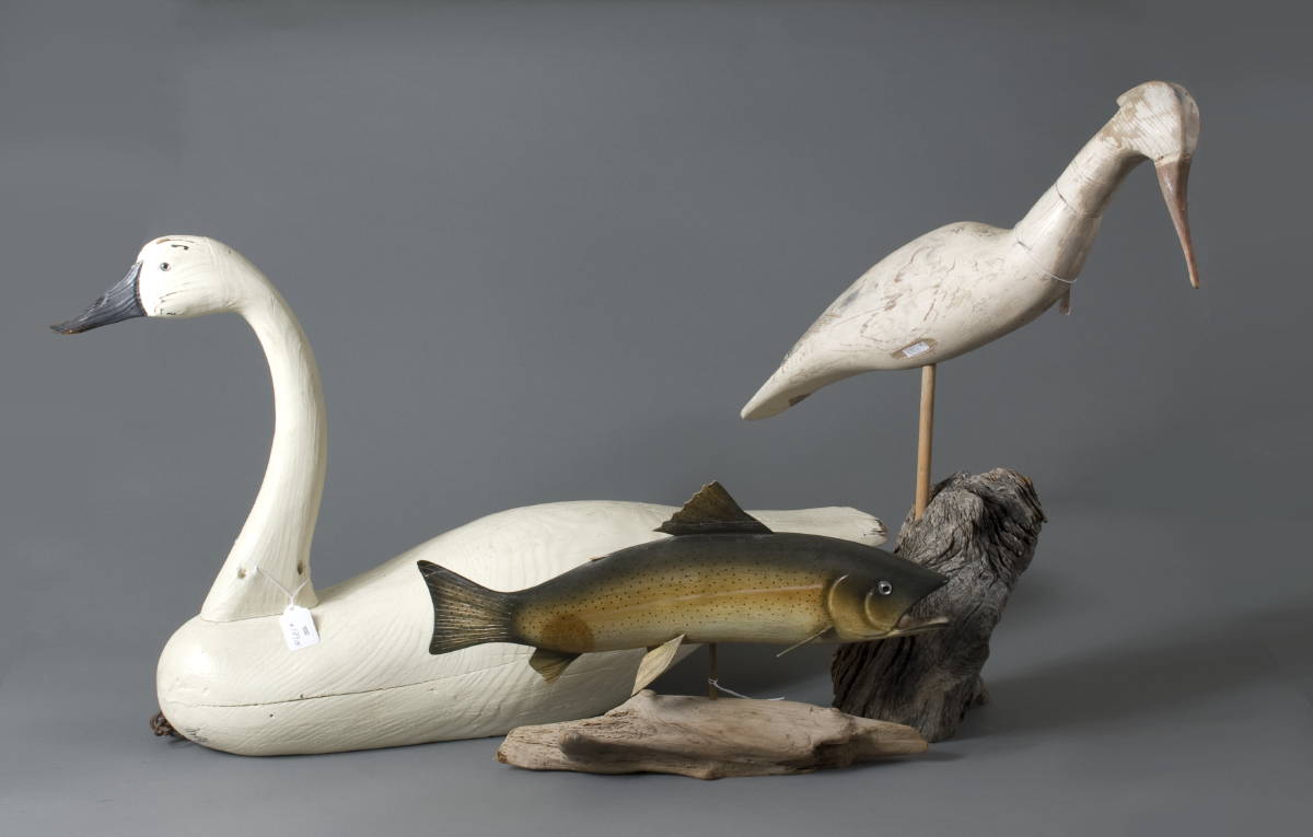 Appraisal: CARVED AND PAINTED SWAN A HERON AND A TROUT THE