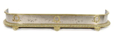 Appraisal: A French Empire steel and brass fender with laurel wreath