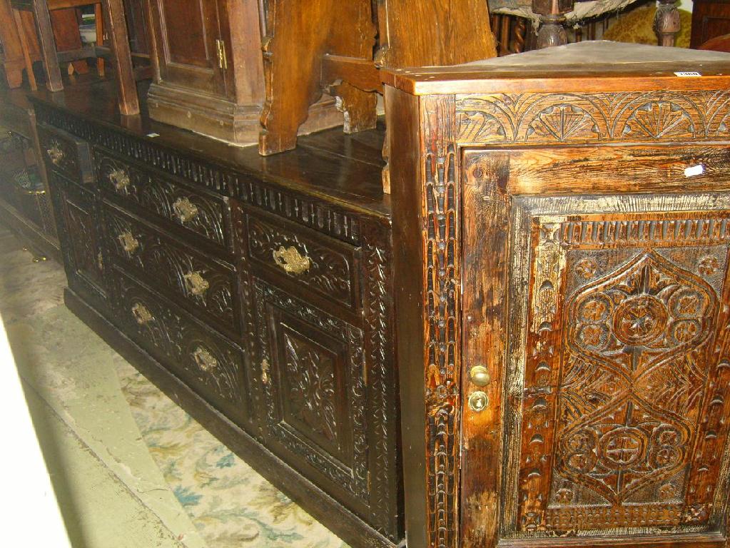 Appraisal: A th century oak dresser base fitted with an arrangement