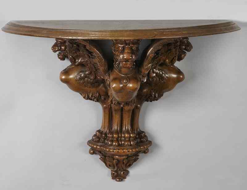 Appraisal: Victorian Renaissance Revival walnut wall brackethaving a molded demilune shelf