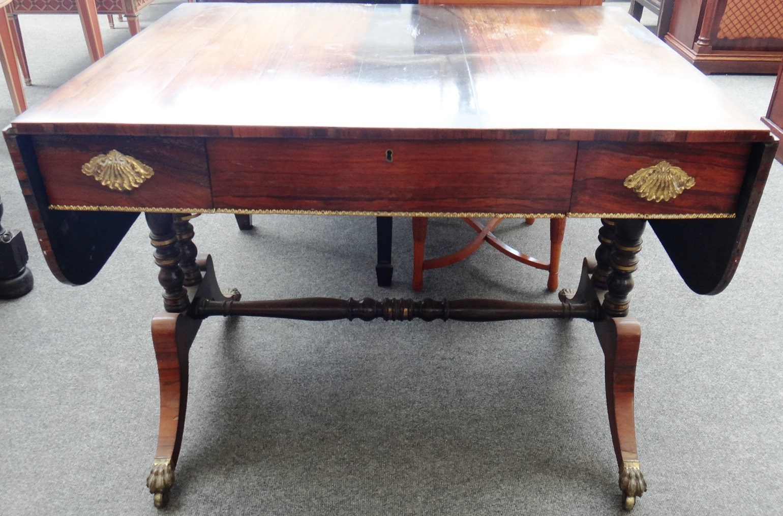 Appraisal: A th century gilt metal mounted rosewood sofa table on