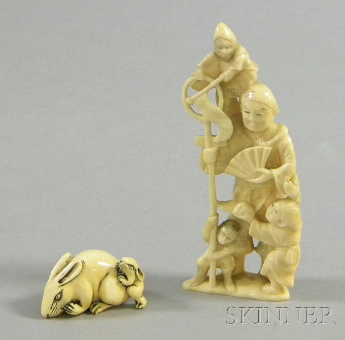 Appraisal: Two Japanese Ivory Carvings a Netsuke depicting two rabbits and