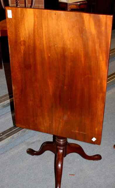 Appraisal: A RECTANGULAR MAHOGANY SNAP TOP OCCASIONAL TABLE with bird cage