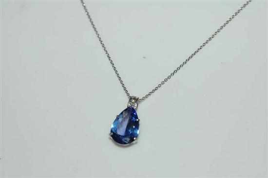 Appraisal: A TANZANITE AND DIAMOND PENDANT IN CT WHITE GOLD