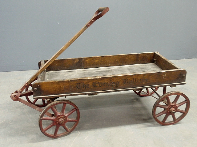 Appraisal: - Wood and metal child s delivery wagon stenciled Evening