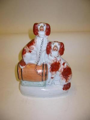 Appraisal: A STAFFORDSHIRE POTTERY GROUP c modelled as two red and