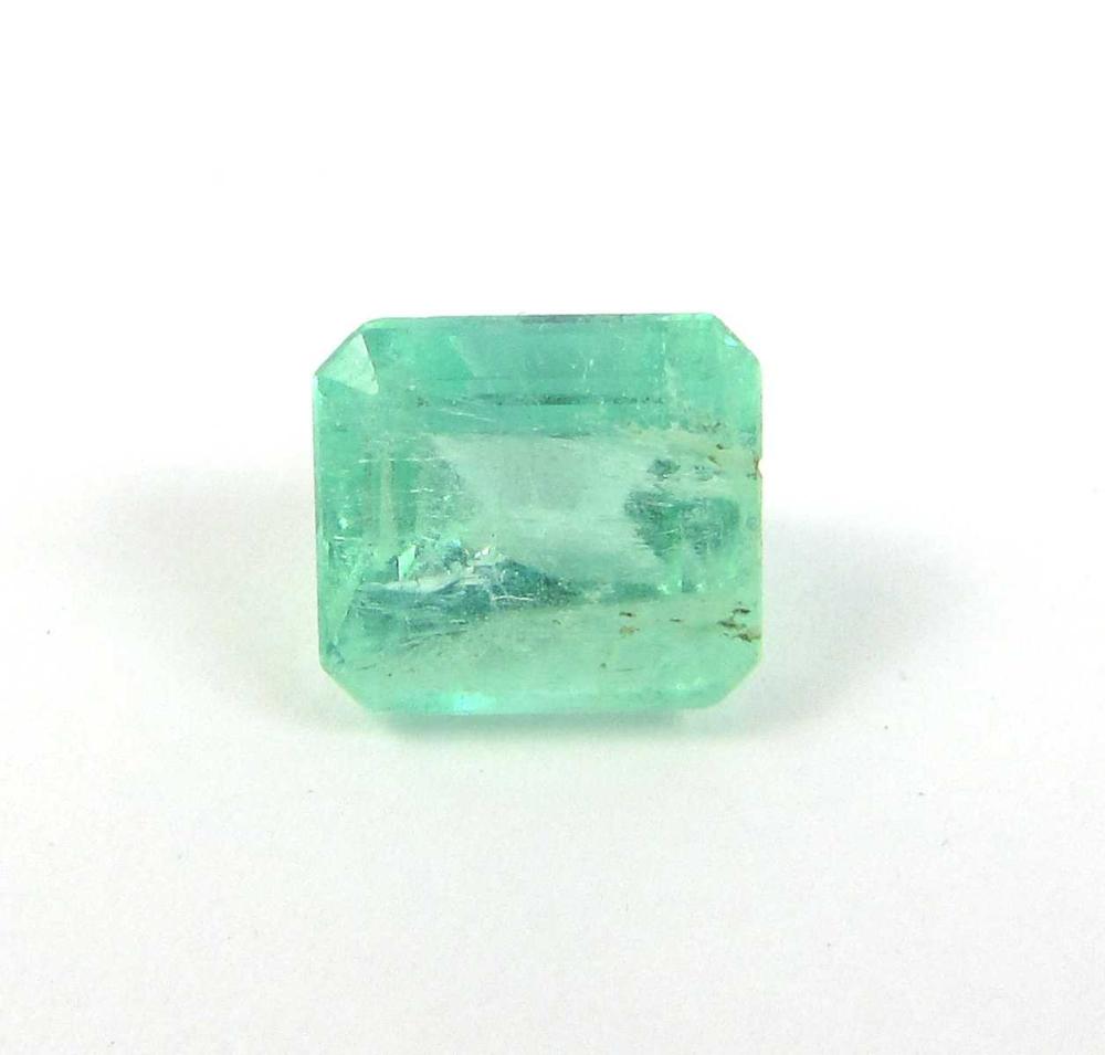 Appraisal: AN UNSET GREEN COLOMBIAN EMERALD WITH GIA REPORT a semi-transparent