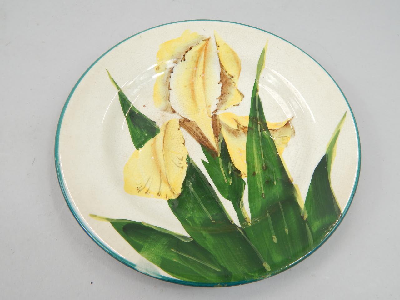 Appraisal: A Wemyss ware small plate painted with a yellow orchid