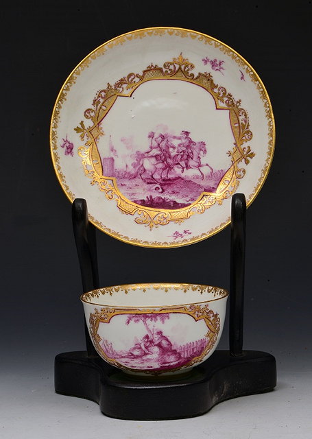 Appraisal: A MEISSEN TEA BOWL AND SAUCER each painted with a